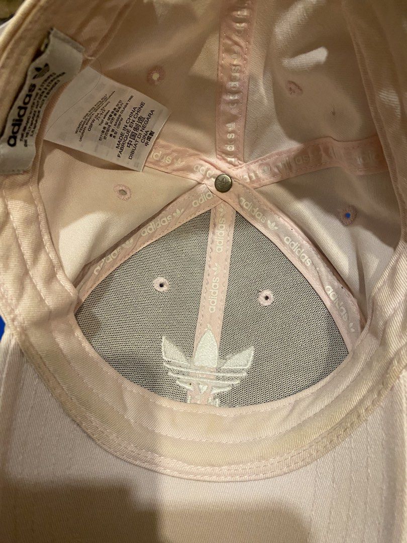 Adidas Light Pink Cap (Category: Caps & Hats) located in Cainta. Submitted by lilxbigloveplayhouse (Listing ID 1465094282, Image 2). Description: - Brand: Adidas - Color: Soft pink - Design: Embroidered trefoil logo on front and underside - Fit: Adjustable strapback closure - Size: Women's OSFW (fits 54 to 57 cm) - Details: Interior branding tape along seams - Origin: Made in China - Condition: Excellent casual everyday headwear.