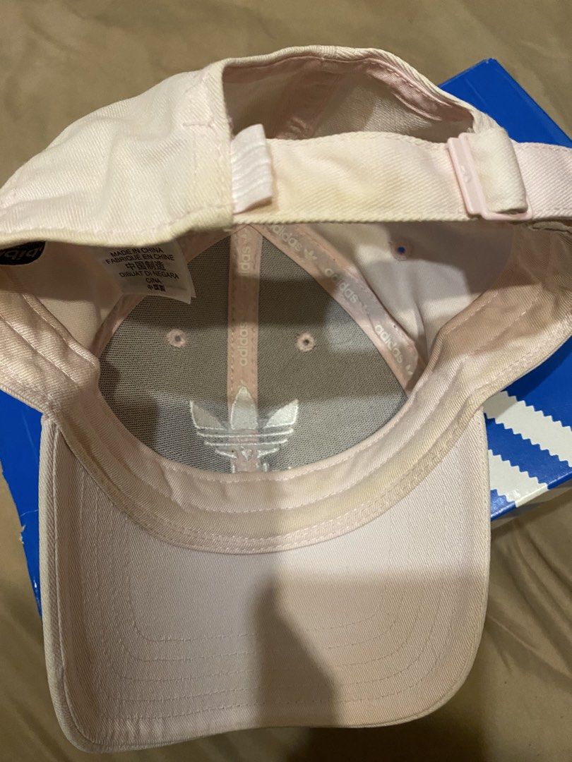 Adidas Light Pink Cap (Category: Caps & Hats) located in Cainta. Submitted by lilxbigloveplayhouse (Listing ID 1465094282, Image 3). Description: - Brand: Adidas - Color: Soft pink - Design: Embroidered trefoil logo on front and underside - Fit: Adjustable strapback closure - Size: Women's OSFW (fits 54 to 57 cm) - Details: Interior branding tape along seams - Origin: Made in China - Condition: Excellent casual everyday headwear.