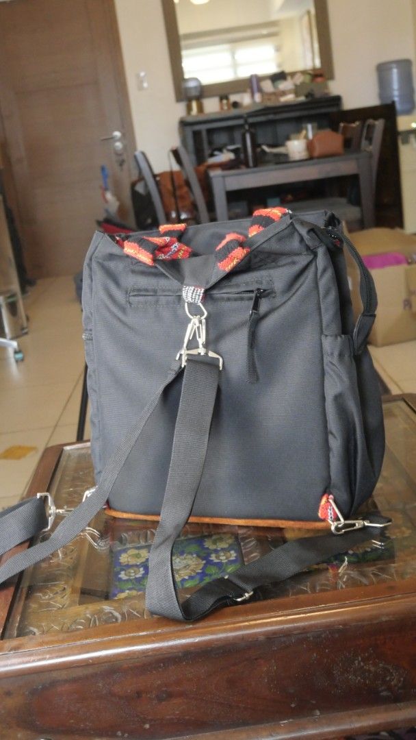Akbay convertible black backpack with patterned straps (Category: Backpacks) located in Taguig. Submitted by spaula76 (Listing ID 1465003527, Image 3). Description: - Brand: AKBAY Habi multi way bag - Material: Durable black canvas with vibrant woven strap accents (red, orange, black) - Versatile Design: Multi-way wear with adjustable shoulder straps and top handles - ​3-way style (tote,shoulder,back pack) ​- Interior and Water Resistant ​-padded