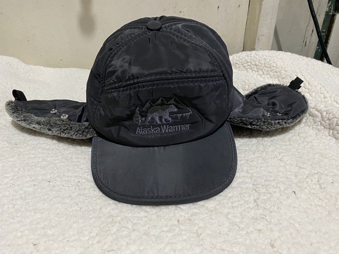 Alaska Warmer Winter Trapper Hat Ear Flaps Black (Category: Caps & Hats) located in Manila. Submitted by resi.diaz (Listing ID 1465040519, Image 1). Description: - Color: Black - Design: Embroidered bear and mountain landscape on front - Warmth: Super cozy furry ear flaps and soft fleece lining - Shell: Durable and sturdy nylon outer shell - Fit: Snap buttons to secure flaps up/down and adjustable elastic drawcord toggle in the back - Perfect for