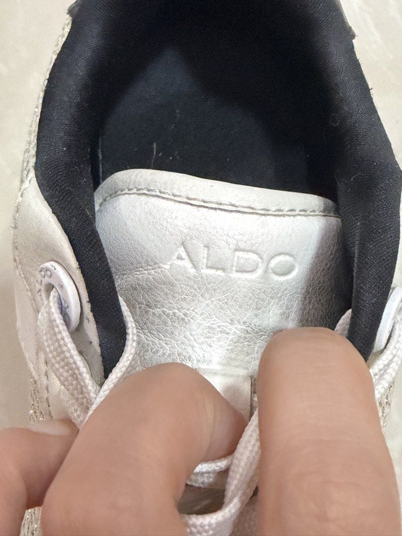ALDO White Sneakers with Heart Soles (Category: Sneakers) located in Paranaque City. Submitted by clairelao (Listing ID 1465006607, Image 2). Description: GOOD AS NEW!!! JUST NEED CLEANING. - Brand: ALDO - Style: White chunky sneakers with black inner lining - Details: Sparkly mesh panels on the toe area, standard lace-up front with white laces - Sole: Thick black rubber sole with an all-over heart pattern on the bottom - Condition: Comfortable d