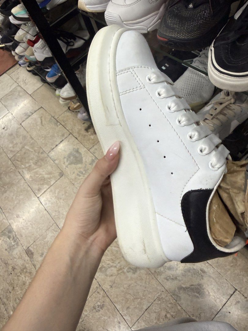 Alexander McQueen Oversized Sneaker White Black (Category: Sneakers) located in Manila. Submitted by fastlion.584bdf (Listing ID 1465071741, Image 3). Description: - Brand: Alexander McQueen - Color: White leather with black heel counter - Features: Iconic chunky rubber platform soles, wide flat laces, and gold foil branding - Condition: Pre-owned; normal scuffs on leather and midsoles, with dirt/wear on bottom soles from walking - Extras: Stuffe