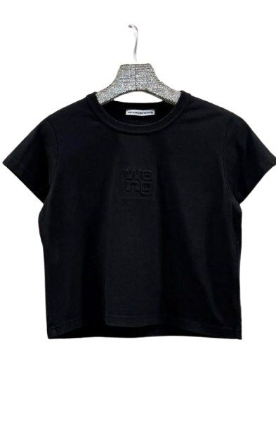 Alexander Wang black t-shirt with embossed logo (Category: Shirts) located in Manila. Submitted by decluterthings888 (Listing ID 1465168331, Image 2). Description: - Brand: Alexander Wang - Color: Classic Black - Style: Short-sleeve - Detail: Subtle embossed 'wang' logo on the chest - Condition: Like new, zero flaws or stains, tag clearly readable - Fit/Styling: Easy to style with high-waisted jeans or skirts, minimalist streetwear essential.