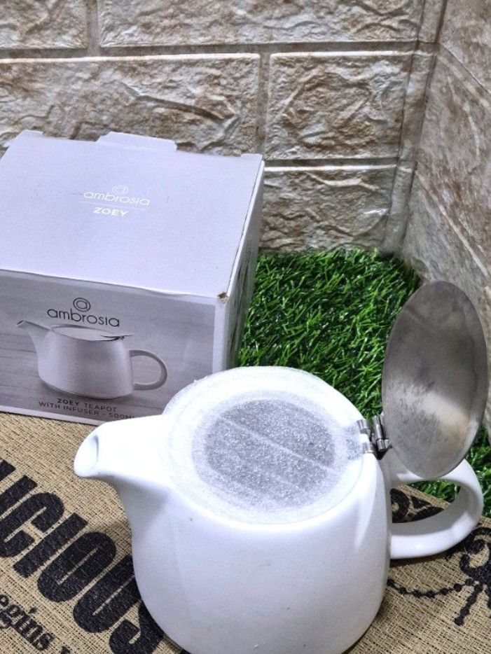 Ambrosia Zoey 500ml Teapot (Category: Other Kitchenware & Tableware) located in Antipolo. Submitted by saribymonica (Listing ID 1465127879, Image 2). Description: The Ambrosia Zoey 500ml Teapot is a compact, single-to-two-cup tea maker designed for brewing loose-leaf tea or tea bags. Key Features & Design Material: Crafted from durable, high-quality stoneware with a clean, contemporary silhouette. Finish: Features a modern, matte white textured e