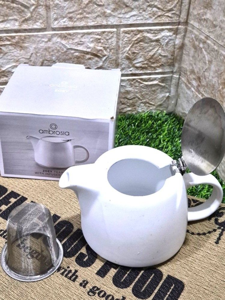 Ambrosia Zoey 500ml Teapot (Category: Other Kitchenware & Tableware) located in Antipolo. Submitted by saribymonica (Listing ID 1465127879, Image 3). Description: The Ambrosia Zoey 500ml Teapot is a compact, single-to-two-cup tea maker designed for brewing loose-leaf tea or tea bags. Key Features & Design Material: Crafted from durable, high-quality stoneware with a clean, contemporary silhouette. Finish: Features a modern, matte white textured e