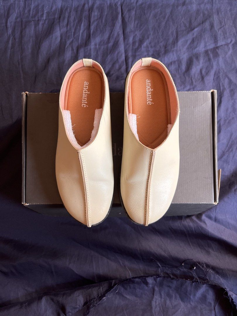 Andante Clog Mule - Cream (Category: Flats & Sandals) located in Antipolo. Submitted by betterera_ (Listing ID 1465039724, Image 2). Description: A slip-on mule with a structured silhouette and a chunky, rubber outsole. Has a distinct center seam running from the vamp to tip. Product Details • 100% lambskin leather upper • Leather lining • Aerifoam soft insole • Lightweight platform outsole • Handmade by fair trade Handmade from 100% full grain l