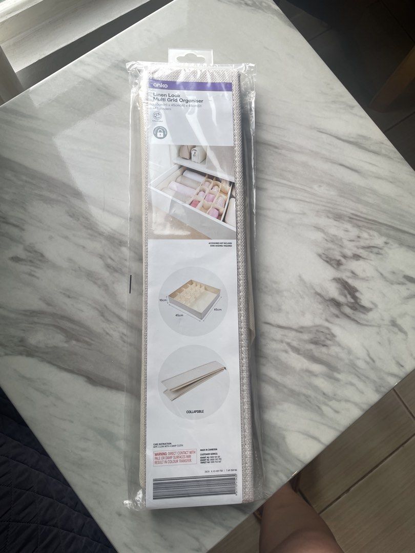 Anko Linen Look Multi Grid Organiser (Category: Storage Boxes & Baskets) located in Cavite. Submitted by justcallmejil (Listing ID 1465068303, Image 1). Description: - Brand new, still sealed in original plastic packaging - Dimensions: 10cm x 45cm x 45cm - Features 12 dividers for easy sorting - Perfect for underwear, socks, and small wardrobe items - Color: Beige - Space-saving collapsible design RFS: Wrong size for my drawer ₱299 📍Pasig 📦 Gog