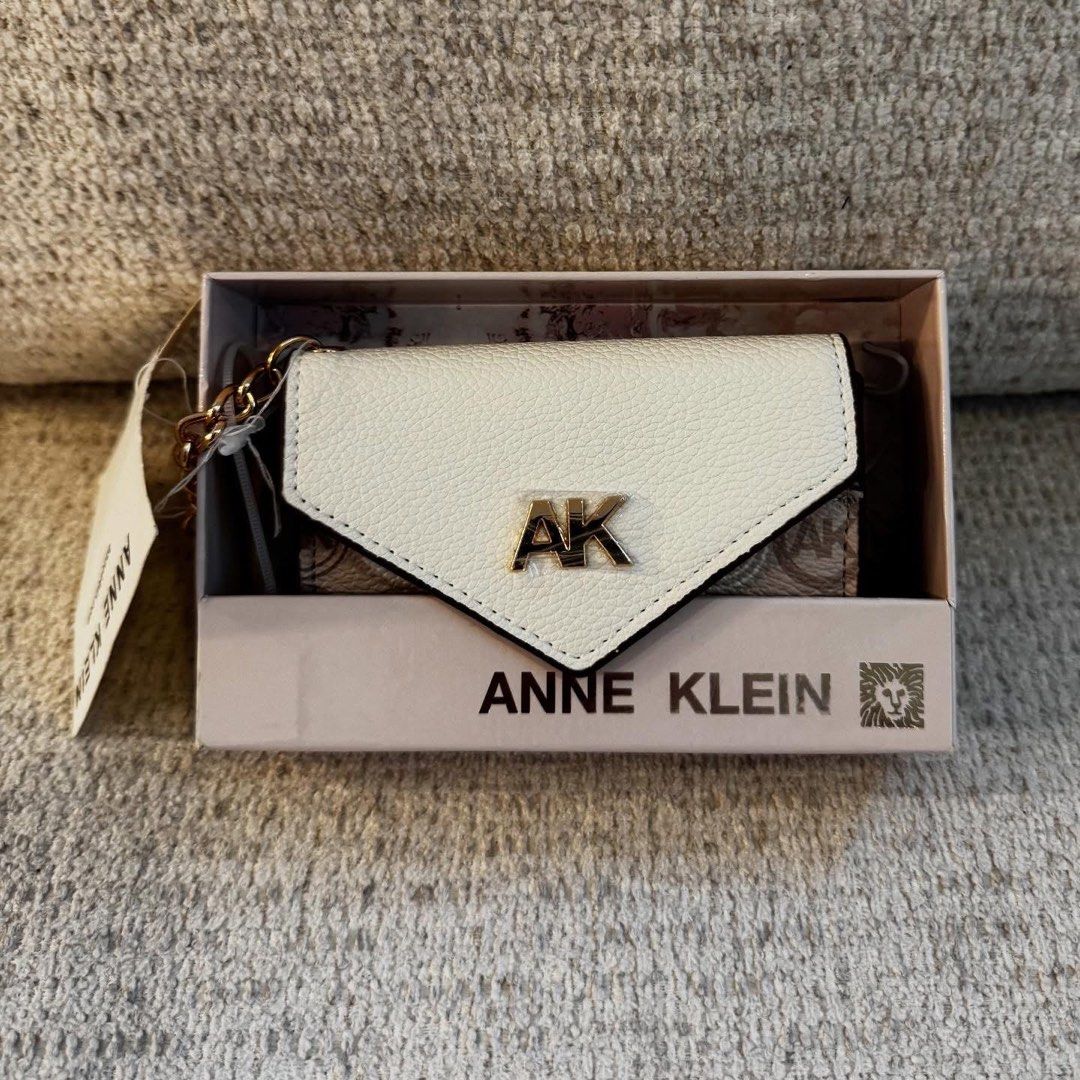 Anne Klein Monogram Card Holder with Box (Category: Wallets & Card holders) located in Manila. Submitted by luwiswisz (Listing ID 1465053751, Image 1). Description: - Brand: Anne Klein - Design: Cream and beige monogram with classic AK logo - Material: Polyurethane body with polyester lining - Closure: Snap button - Features: Interior space for cards and cash - Condition: Brand new, never used, properly stored - Inclusions: Original box and tags 