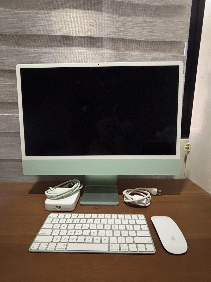 Apple iMac 24-inch M1 (Category: Desktops) located in Manila. Submitted by erin_closet (Listing ID 1465039222, Image 1). Description: Apple iMac 24-inch M1 (Green colorway) - Inclusions: Magic Keyboard, Magic Mouse, power brick, and cable - Issue: Visible screen lines and flickering on screen.