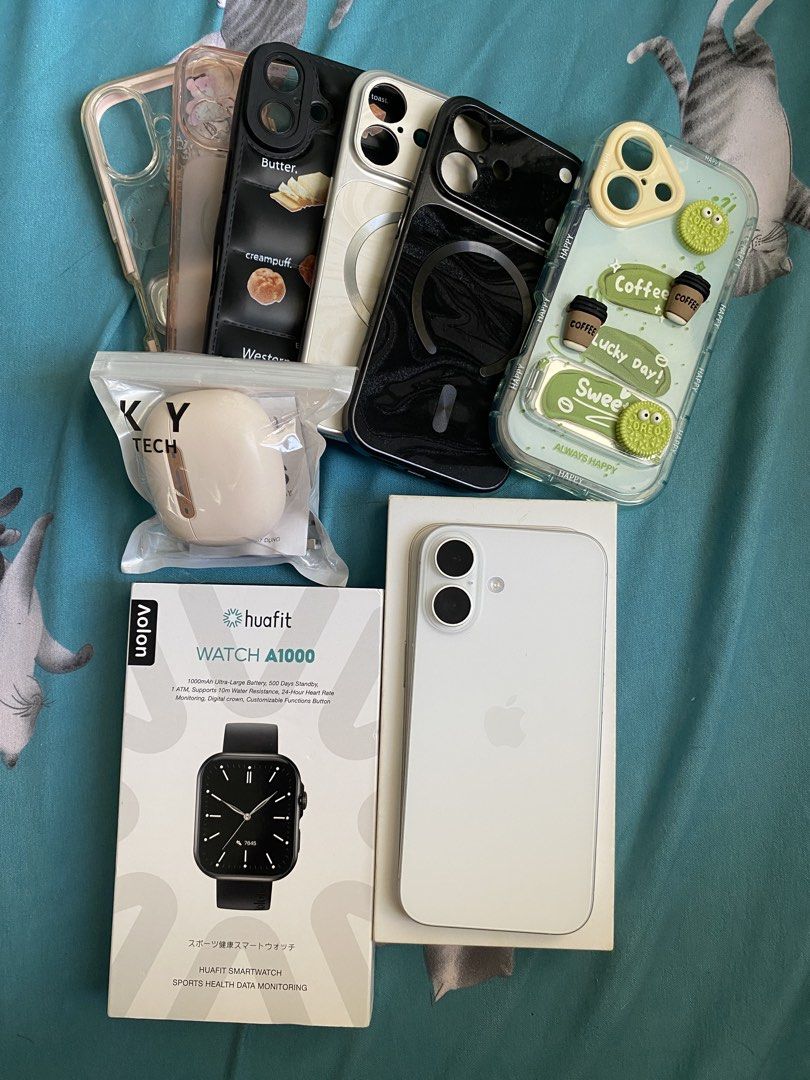 Apple iPhone 16 White with Original Box and Cases (Category: iPhone 16 Series) located in Iloilo. Submitted by angelenepe01084 (Listing ID 1465097713, Image 1). Description: - Model: Apple iPhone 16 (White) - Condition: Clean screen, excellent working condition - Inclusions: Original retail box, several protective cases, packaged earbuds, and an extra smartwatch - Note: All items pictured are included as a complete bundle - Reason for selling: Up