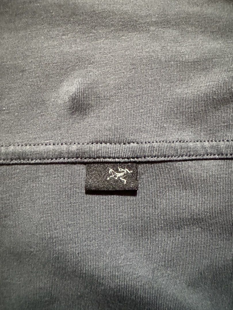 Arc'teryx Captive SS Polo Men's Size Large Blue (Category: Tshirts & Polo Shirts ) located in Caloocan City. Submitted by gabbieerfritter (Listing ID 1465141769, Image 3). Description: - Brand: Arc'teryx - Style: Captive Short Sleeve Polo Shirt - Color: Blue - Size: Men's Large - Material: Lightweight knit fabric - Features: Classic button placket with branded buttons, small logo tab on chest - Origin: Made in Indonesia - Condition: Clean tags, g