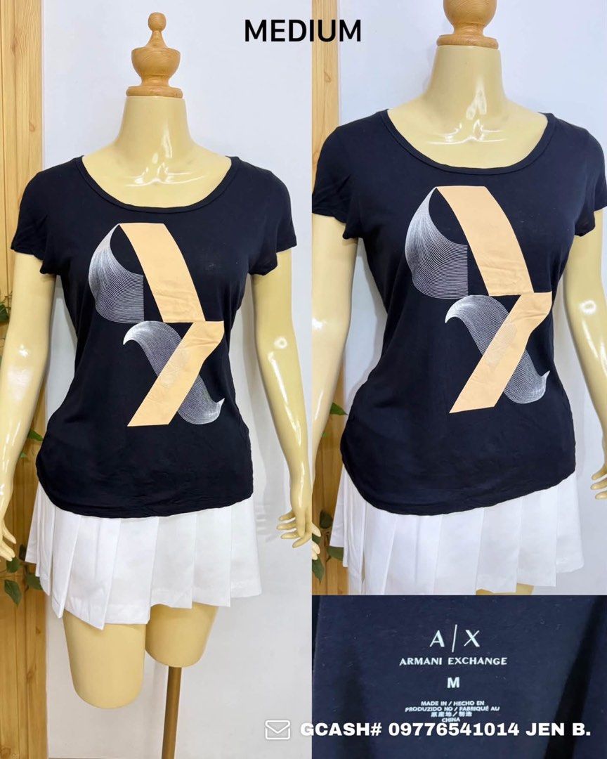 Armani Exchange Black Graphic T-Shirt Medium (Category: Tshirts & Polo Shirts ) located in Tagum. Submitted by bernardino49694 (Listing ID 1465007732, Image 1). Description: - Brand: Armani Exchange - Size: Medium (Regular fit) - Color: Black with beige and silver abstract graphic print - Material: Soft, comfortable cotton - Design: Scoop neckline and short sleeves - Condition: Excellent, verified brand and sizing tags - Style: Versatile and easy