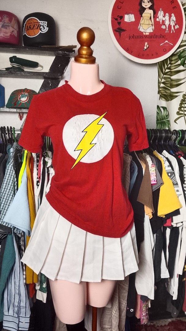 Arrive Guide The Flash Graphic Tee Red Size S (Category: Tshirts & Polo Shirts ) located in Manila. Submitted by johans9 (Listing ID 1465082110, Image 1). Description: - Brand: Arrive Guide - Size: Small (34-36) - Material: 100% heavy weight cotton - Design: Red t-shirt featuring The Flash logo with a yellow lightning bolt inside a white circle - Condition: Graphic shows some cracking and wear from previous use - Style: Classic crew neckline and 