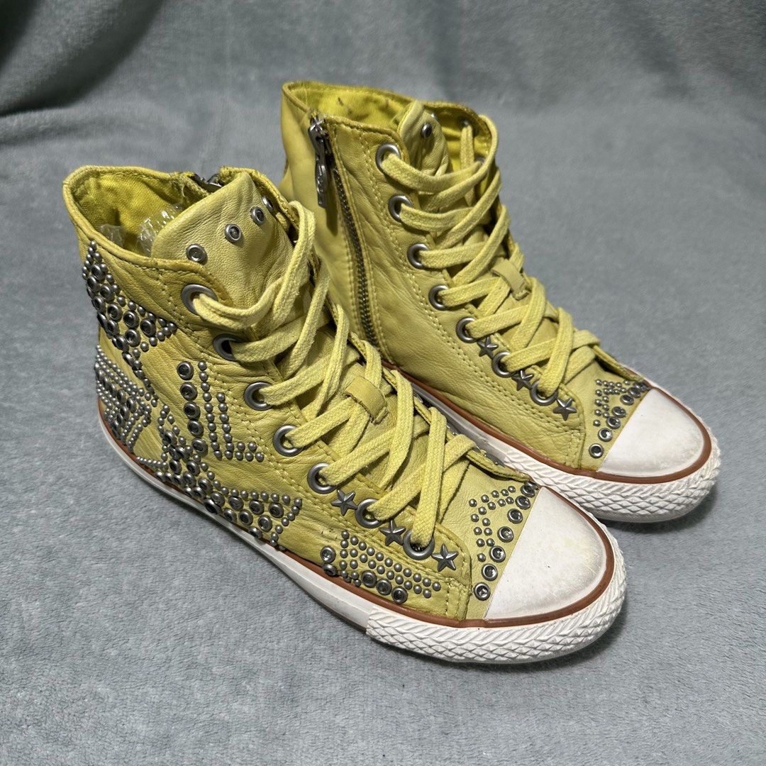 ASH Yellow Leather High Top Sneakers with Studs (Category: Sneakers) located in Bayombong. Submitted by rochelle_archive_garments (Listing ID 1464990980, Image 2). Description: - Brand: ASH - Style: Yellow leather high top sneakers - Details: Covered in metal studs, star accents, and heavy hardware - Closure: Side zipper and standard lacing for easy wear - Design: Contrast white rubber toe caps and soles - Special Feature: Interior fabric tag ind