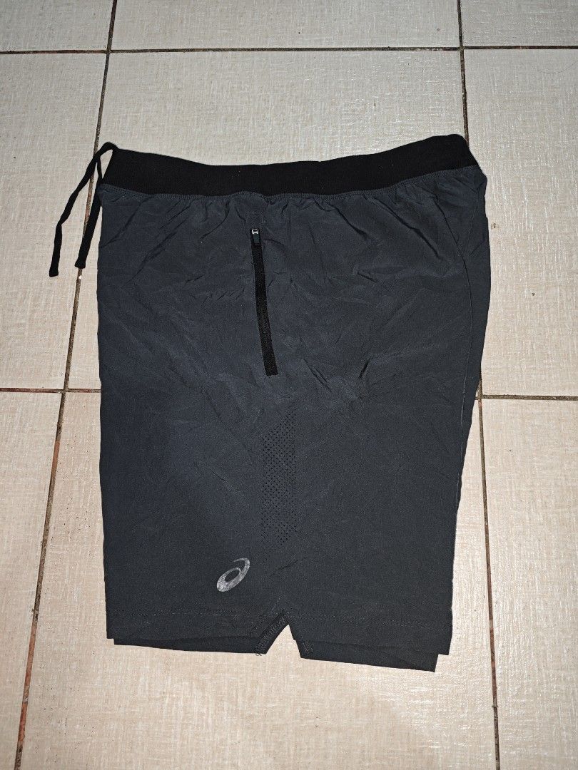 Asics Running Shorts with Zipped Pockets (Category: Activewear) located in Manila. Submitted by lilianapat52117 (Listing ID 1465070096, Image 3). Description: ASICS SHORT ZIP SIDE POCKETS CUT INNER&TAGS DARK GREY WAIST 30-34 LENGTH 19½ VGUC CUT INNER&TAGS MINOR FADE-LOGO 400.