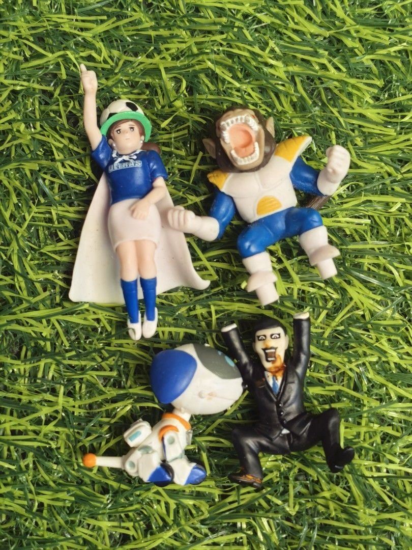 Assorted anime and cartoon mini action figures bundle (Category: Figurines & Statues) located in Paranaque City. Submitted by furugiyafinds (Listing ID 1465009597, Image 1). Description: - Set of 4 mini collectible figures - Includes: female character in blue soccer jersey with cape, armored ape-like creature, white and blue robot toy, and man in black suit with open mouth expression - Perfect for toy collectors or cute desk display - Sold as a c