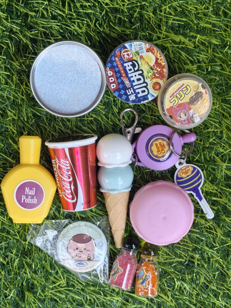 Assorted Miniature Toys Coke Lip Smacker Keychains Slime Containers (Category: Kids Toys) located in Paranaque City. Submitted by furugiyafinds (Listing ID 1465005012, Image 1). Description: - Adorable bundle of miniature toys, keychains, and small container items - Includes Coca-Cola Lip Smacker cup, nail polish toy, ice cream cone, and Chupa Chups keychain - Features a Korean ramen bowl container, star-filled glitter bottles, and a sealed Kuras