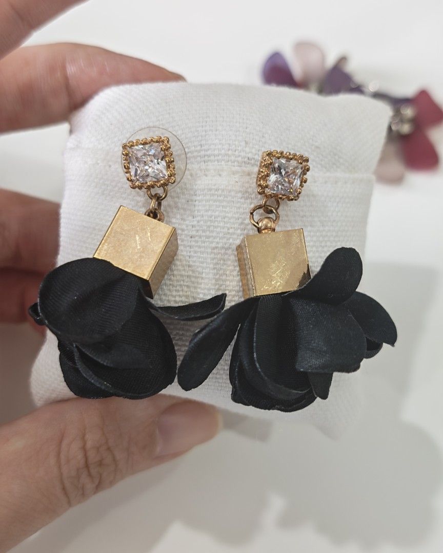 Assorted Statement Earrings Bundle (Category: Earrings) located in Petaling Jaya. Submitted by dovey88 (Listing ID 1464993473, Image 2). Description: - Product: 3-Pair Earring Bundle (Selling as a set only) - Pair 1: Red Chinese knot tassels for a festive touch - Pair 2: Black fabric flowers with gold-tone square beads and crystal studs - Pair 3: Multi-colored translucent petal charms on silver-tone rhinestone hooks - Features: Lightweight and ve