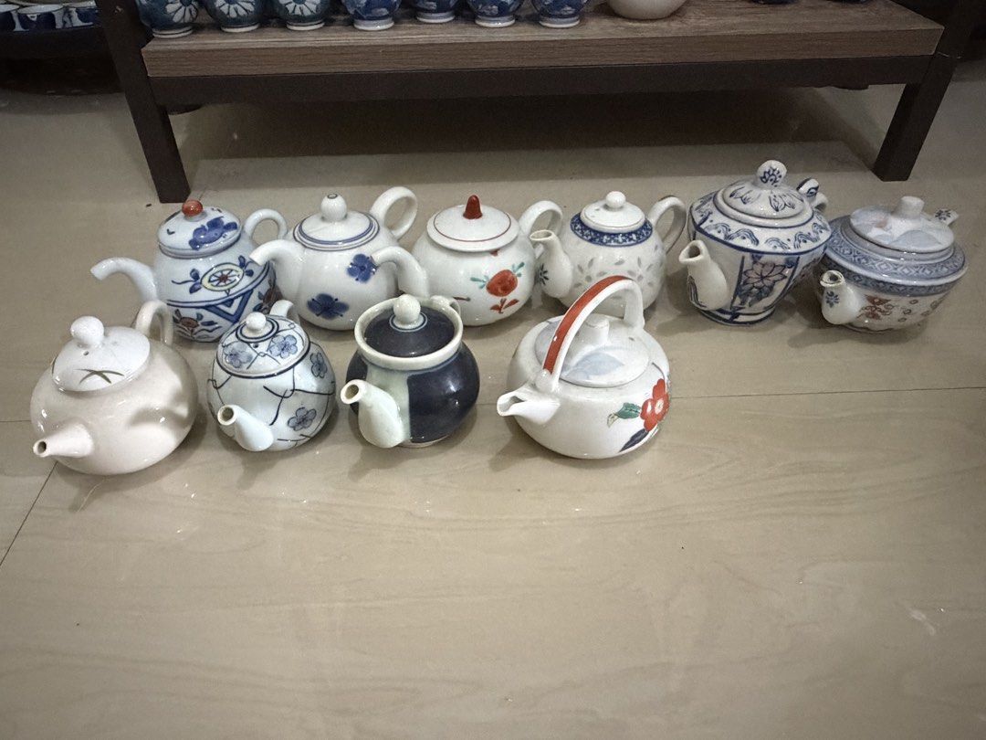 Assorted Vintage Ceramic Teapots Collection (Category: Coffee & Tea Tableware) located in Manila. Submitted by ginatan197811 (Listing ID 1464981030, Image 1). Description: - Collection of ceramic teapots with matching lids - Available in blue & white, red floral motifs, and neutral glazes - Variety of styles, sizes, and patterns (floral and geometric) - Ideal for tea enthusiasts and Asian ceramicware collectors - Buy individual pots or get the wh