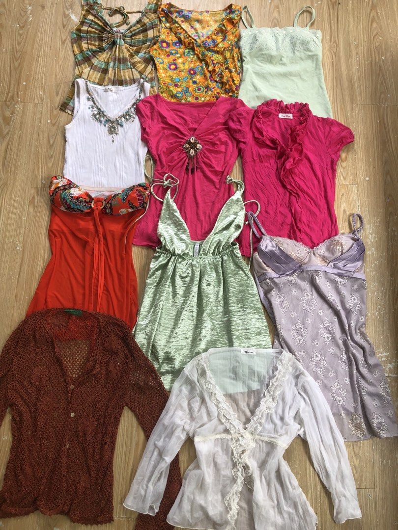 Assorted Y2K boho camis, tops and cardigans bundle (Category: Blouses) located in Manila. Submitted by tunicy2k (Listing ID 1465022893, Image 1). Description: - Bundle of 10 different tops and camisoles - Includes plaid halter, floral blouse, pastel green cami, beaded white tank, pink ruffled shirts, orange halter, metallic green swing cami, floral satin slip dress, brown crochet cardigan, and white sheer lace-trim top - Mix of bohemian and Y2K a