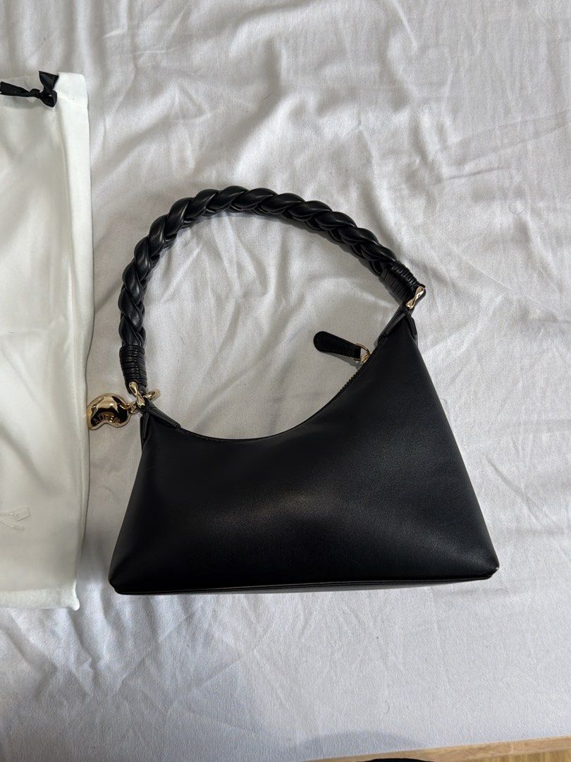 Aupen Black Leather Shoulder Bag with Braided Handle (Category: Shoulder Bags) located in Quezon. Submitted by gabriel_borres (Listing ID 1464993564, Image 1). Description: - Brand new/Pristine condition black Aupen shoulder bag - Crafted from smooth leather with a structured rectangular base - Unique braided handle accented with a cute gold-tone heart charm - Secure top zipper closure for daily essentials - Comes complete with original white dus