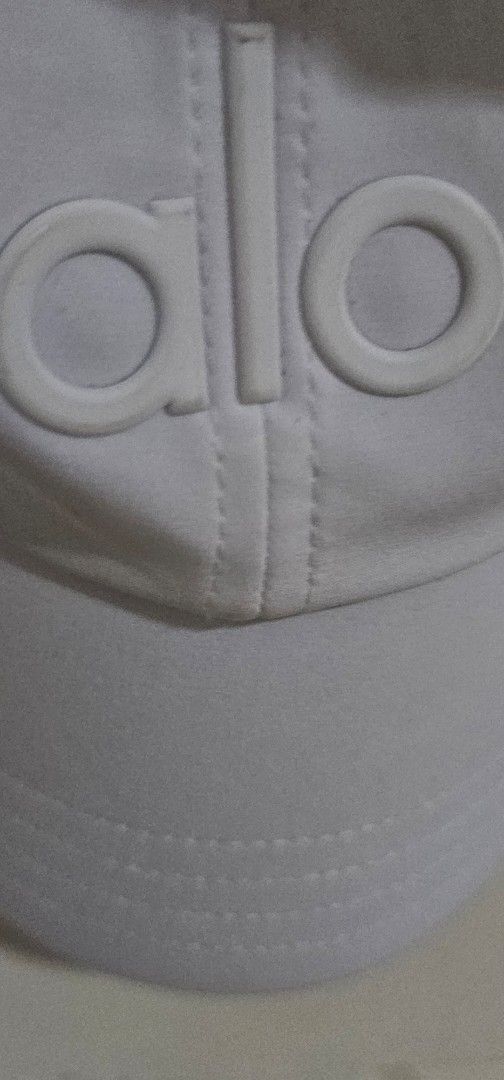 Authenric Alo Yoga White Cap (Category: Caps & Hats) located in Davao. Submitted by sachigo (Listing ID 1465078872, Image 2). Description: - Brand: Alo Yoga - Color: Clean White - Design: Classic raised logo on front - Fit: One size fits most (adjustable strap) - Condition: Brand new with internal tags - Origin: Made in China - Ideal for: Gym workouts, running errands, or casual streetwear - PM for quick transactions and shipping!.