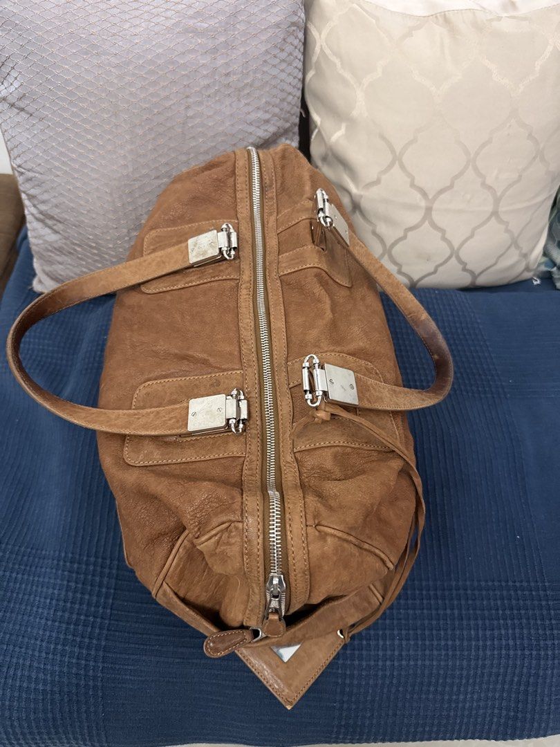 Authentic Balenciaga City Boston Bag (Category: Luxury Bags & Wallets) located in San Pablo. Submitted by iamtrina (Listing ID 1464994189, Image 3). Description: Heavily stained; this would look amazing if color changed to a dark color or retain as is for a rugged edgy look Comes with mirror 3 corner pipings exposed Guaranteed authentic Pls see inner tag photo with serial codes Can be carried as top handle or on the shoulder.