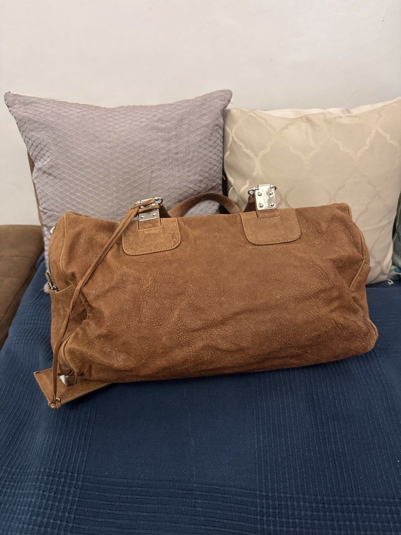 Authentic Balenciaga City Boston Bag (Category: Luxury Bags & Wallets) located in San Pablo. Submitted by iamtrina (Listing ID 1464994189, Image 2). Description: Heavily stained; this would look amazing if color changed to a dark color or retain as is for a rugged edgy look Comes with mirror 3 corner pipings exposed Guaranteed authentic Pls see inner tag photo with serial codes Can be carried as top handle or on the shoulder.