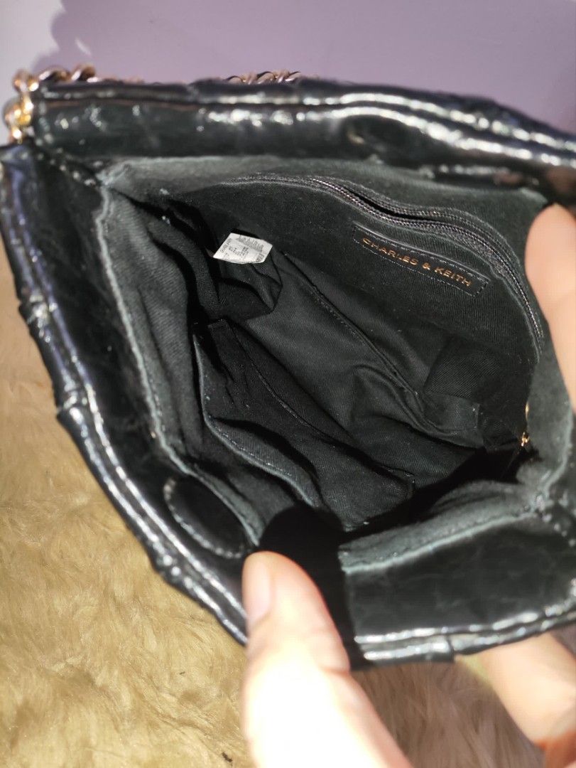 Authentic Charles & Keith duo chain shoulder bag (Category: Shoulder Bags) located in Rizal. Submitted by hsiri1128 (Listing ID 1465085099, Image 3). Description: 💯✔️Legit CONDITION : 9/10 ISSUE / FLAWS : Missing ung long chain nya para maging back pack xa and sling. MATERIAL : Faux Leather w/ gold hardwares DETAILS : Fit notebook and long wallet. very black in actual, no visible rubs/bakbak. magnetic closure.