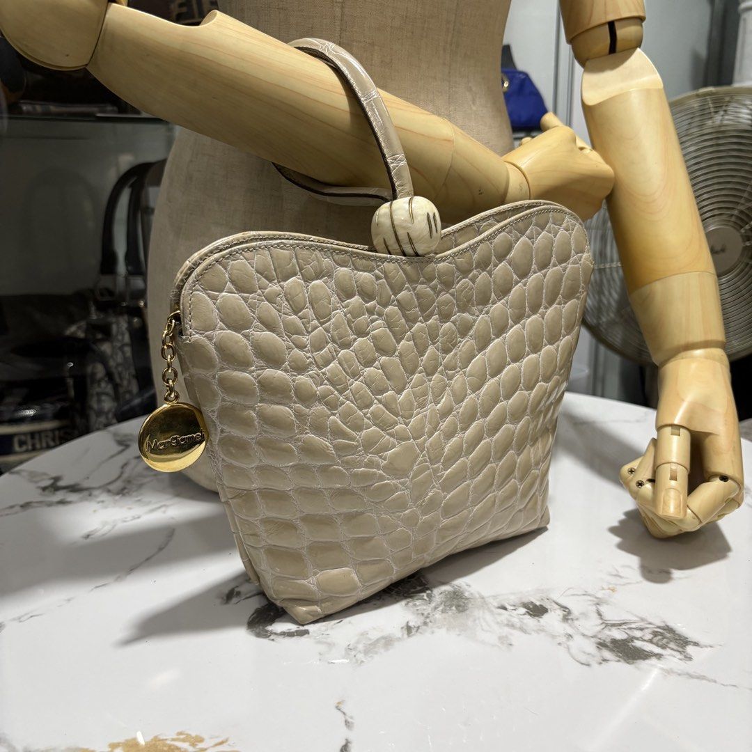 Authentic Egal by Mangiameli Genuine Crocodile Hand bag (Category: Purses & Pouches) located in Binangonan. Submitted by makoleksyon (Listing ID 1465017443, Image 2). Description: Excellent condition Like new No flaws Rare Size: H-7 x W-9.5 x D-2 inches Made in Italy Real crocodile leather Opti zipper Bought in Japan 💯% Authentic Money back guarantee Bought in Japan 💯% Authentic Money back guarantee .