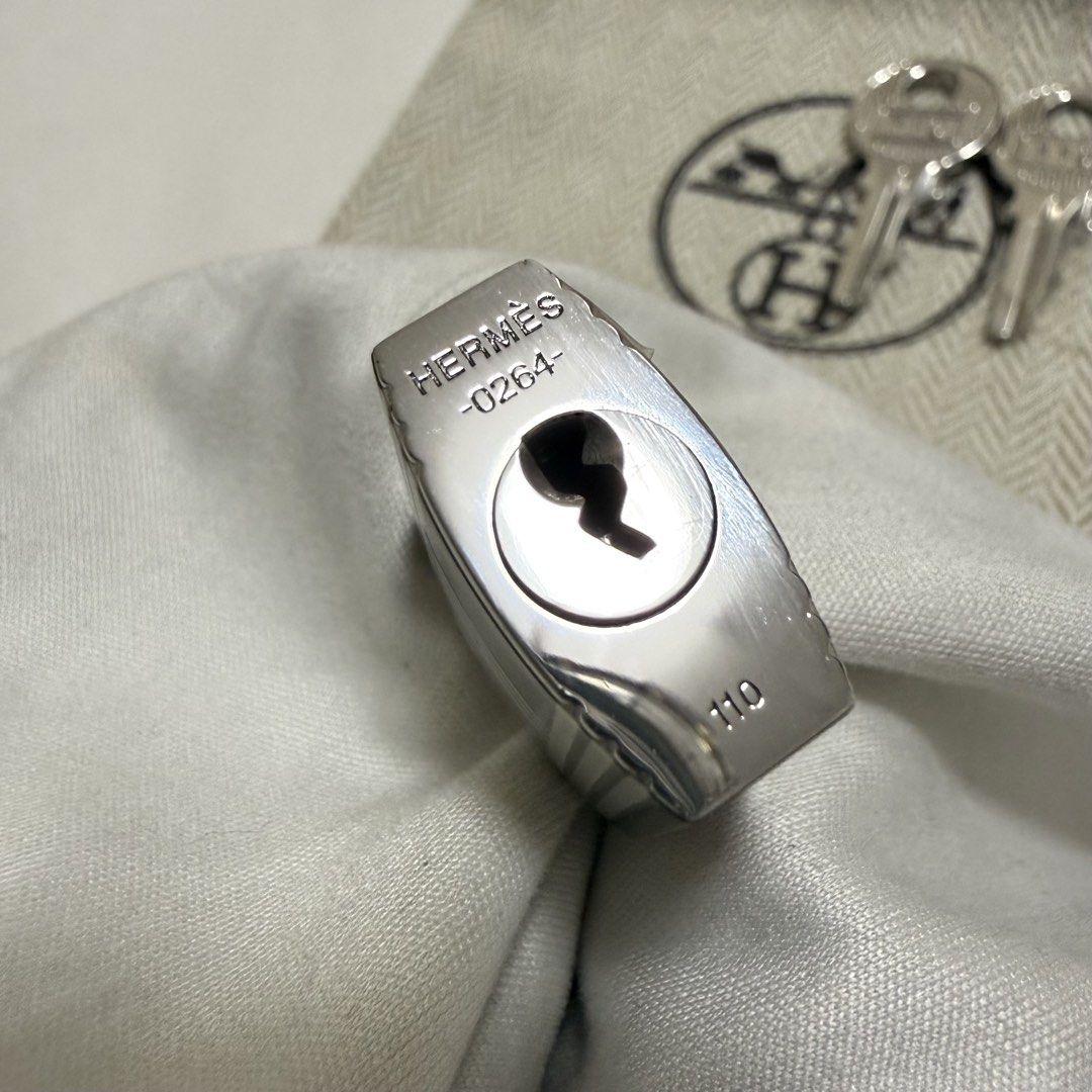 Authentic Hermes Padlock Palladium (Category: Luxury Bags & Wallets) located in Manila. Submitted by poppyany (Listing ID 1465074755, Image 2). Description: Authentic Hermes H Padlock in Palladium. Comes with 2 keys, and small Dustbag..
