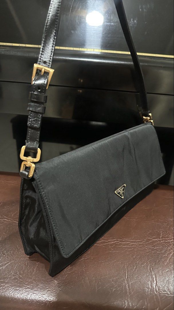 Authentic Prada Black Nylon Shoulder Bag (Category: Luxury Bags & Wallets) located in Las Pinas. Submitted by marshmallowmax (Listing ID 1465060746, Image 3). Description: Guaranteed Orig no flaws with dustbag. L-10 x H-5”.