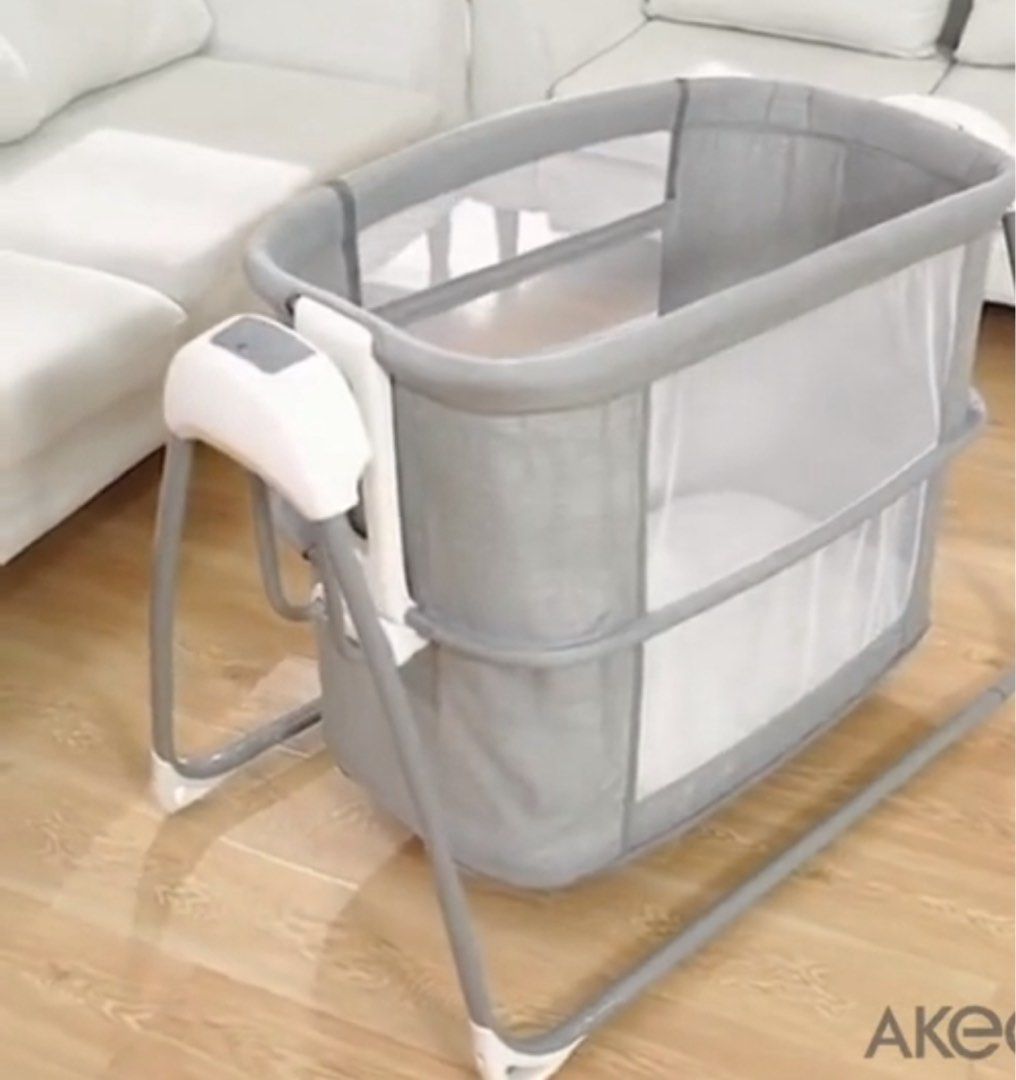 Autoswing Akeeva Luxury Crib Autosway Sidebed D37 (Category: Cots & Cribs) located in Manila. Submitted by queen_k (Listing ID 1465092300, Image 1). Description: - Model: Akeeva Luxury Crib D37 Autosway Sidebed - Color: Elegant grey and white scheme - Comfort: Includes a plush, soft mattress inside - Safety & Breathability: Equipped with mesh sides for optimal airflow - Convenience: Automatic swinging function controlled easily via the side panel