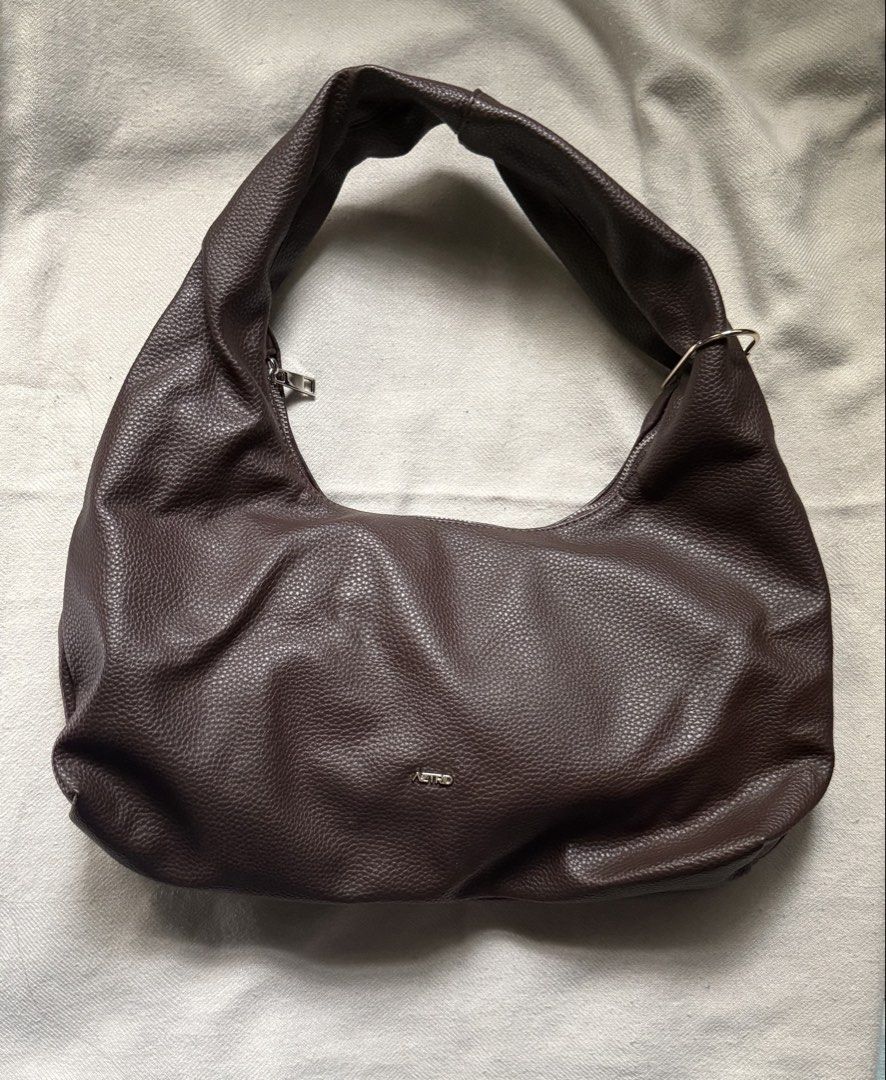 AZTRID Medium Hobo Bag - Dark Brown (Category: Shoulder Bags) located in Quezon City. Submitted by the.wardrobee (Listing ID 1464988775, Image 1). Description: NEVER BEEN USED! bought for Europe trip. Box not included anymore! ———- DETAILS 🛍️ • RFS: Need funds • Condition: Preloved / Secondhand (unless stated otherwise) • Please manage your expectations when purchasing preloved items. Minor signs of wear may be present. • Please check all photos