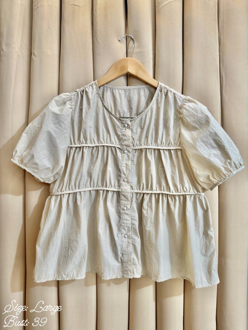 Babydoll Blouse (Category: Blouses) located in Manila. Submitted by glamstylemnl (Listing ID 1465145467, Image 1). Description: ♡ SIZE: L ♡ BUST: 39 ♡ Swipe left to see the actual color & details ♡ front button / tiered detail ♡ HQ • 10/10 ♡ Ready to wear 👚.