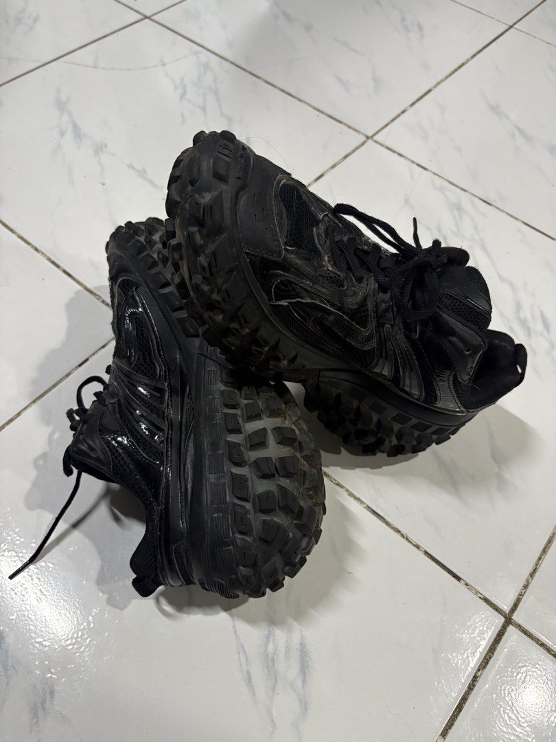 Balenciaga Defender Black Size 41 (Category: Sneakers) located in Manila. Submitted by skeletal_v2 (Listing ID 1465104350, Image 1). Description: GOOD CONDITION NEED WASH - Brand: Balenciaga - Model: Defender Sneakers - Color: All Black - Size: 41 (labeled on toe bumper and heel) - Material: Mesh and synthetic upper - Design: Iconic chunky tire tread sole with embossed branding - Closure: Lace-up with black laces - Condition: Worn condition with 