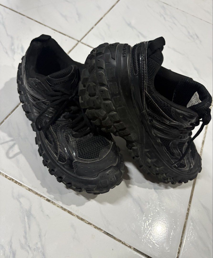 Balenciaga Defender Black Size 41 (Category: Sneakers) located in Manila. Submitted by skeletal_v2 (Listing ID 1465104350, Image 3). Description: GOOD CONDITION NEED WASH - Brand: Balenciaga - Model: Defender Sneakers - Color: All Black - Size: 41 (labeled on toe bumper and heel) - Material: Mesh and synthetic upper - Design: Iconic chunky tire tread sole with embossed branding - Closure: Lace-up with black laces - Condition: Worn condition with 
