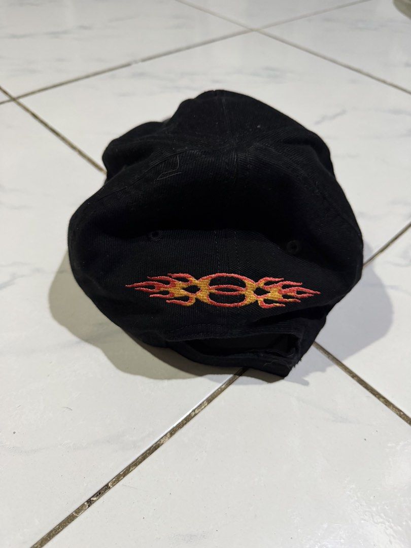Balenciaga Flame Embroidery Baseball Cap Black (Category: Caps & Hats) located in Manila. Submitted by swag_shop00 (Listing ID 1465102530, Image 3). Description: - Brand: Balenciaga - Color: Black - Material: 100% Cotton (Made in Italy) - Design: Flame embroidery on front and back panels - Details: Balenciaga logo embroidered on the curved brim - Fit: Adjustable strap at the back - Condition: Clean interior lining with proper brand tags attached.