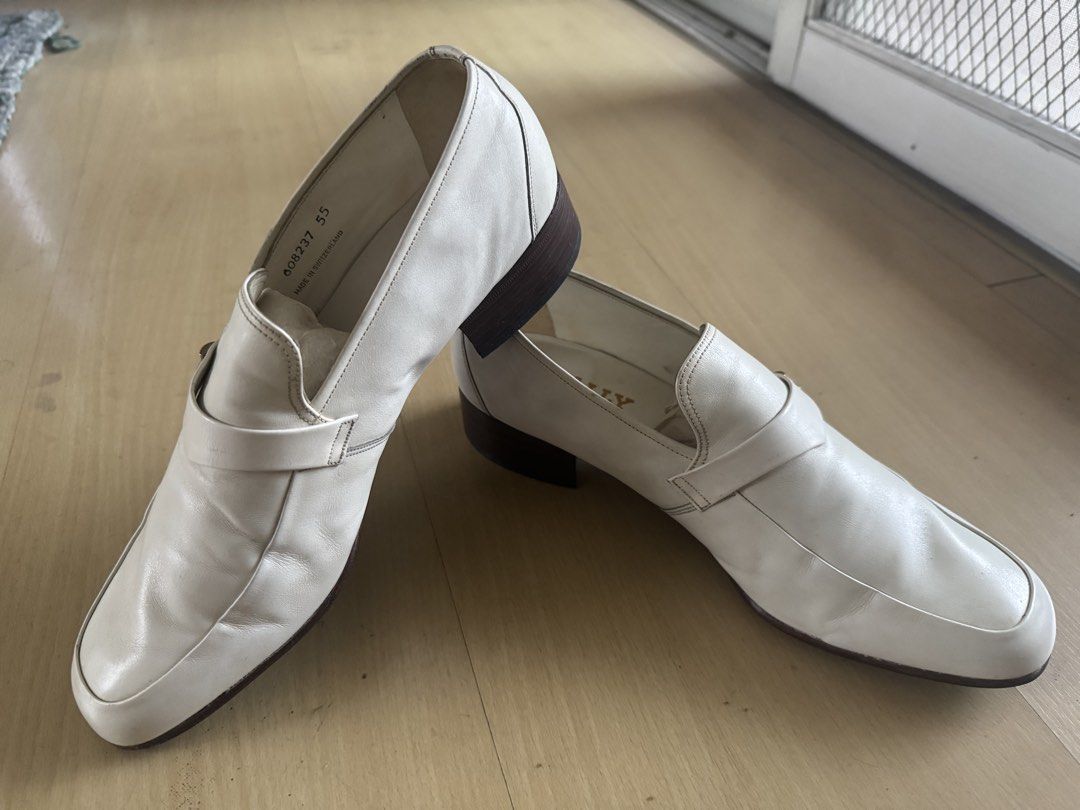 Bally Lucerne White Leather Loafers Size 7.5 E (Category: Dress Shoes) located in San Juan City. Submitted by nel.ward.ed (Listing ID 1465018652, Image 1). Description: - Brand: Bally of Switzerland - Style: Slip-on dress shoes / loafers - Color: Classic white - Material: Premium leather - Size: 7.5 E - Details: Small decorative metal accent on the strap, low stacked heels, and gold foil insole branding - Origin: Made in Switzerland - Condition: 