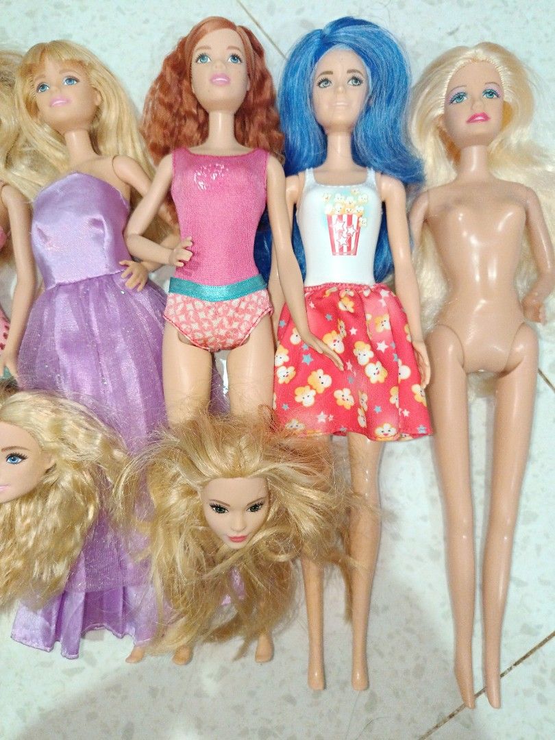 Barbie Dolls (SOLD AS SET) (Category: Kids Toys) located in Taguig. Submitted by pringlesshop2024 (Listing ID 1465165107, Image 3). Description: - Set of 6 fashion dolls - Hair colors: Blonde, red, and blue - Assorted outfits: Pink swimsuits, floral dresses, and purple gowns - Ideal for toy collections or playtime - Selling all together as a set.