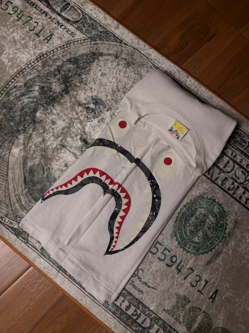 Bathing ape (Category: Luxury Apparel) located in Candelaria. Submitted by ballerthrift796 (Listing ID 1464979266, Image 2). Description: Bathing ape Good condition Isue minimal hairline W- 20 L- 27.