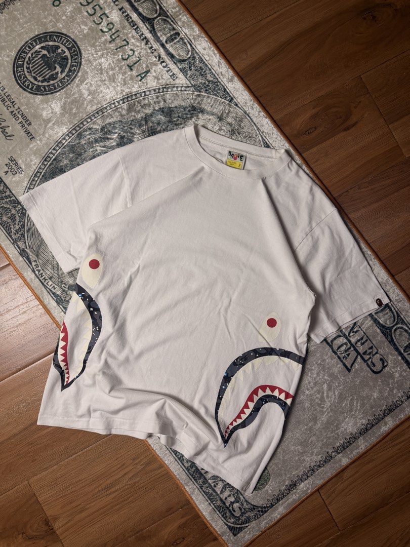 Bathing ape (Category: Luxury Apparel) located in Candelaria. Submitted by ballerthrift796 (Listing ID 1464979266, Image 1). Description: Bathing ape Good condition Isue minimal hairline W- 20 L- 27.