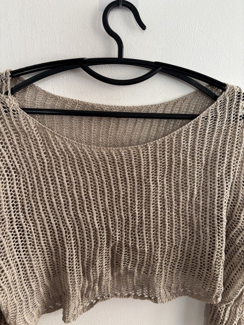Beige Knitted Long Sleeve Crop Top (Category: Longsleeves) located in Muntinlupa City. Submitted by jc444_ (Listing ID 1465111577, Image 2). Description: - Color: Neutral beige - Style: Long sleeve knitted crop top with scoop neckline - Texture: Lightweight open-knit, loose mesh - Condition: Brand new, unworn (no tags) - Versatility: Great for layering over bralettes or swimsuits.