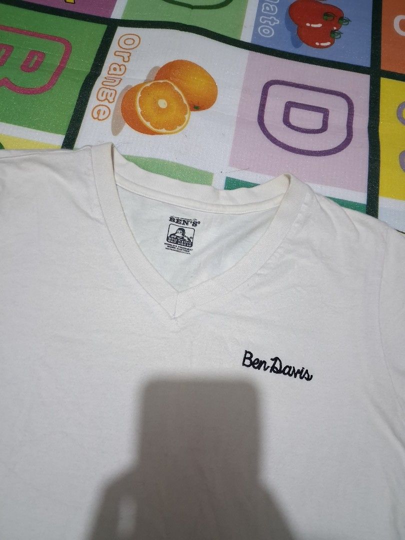 Ben Davis White V-Neck T-Shirt (Category: Tshirts & Polo Shirts ) located in Manila. Submitted by rossthrift (Listing ID 1465131069, Image 3). Description: - Brand: Ben Davis - Color: White - Style: V-neck, short sleeves, classic basic fit - Detail: Small embroidered logo on chest - Size: Men's free size - Condition: Great for casual, everyday outfits.