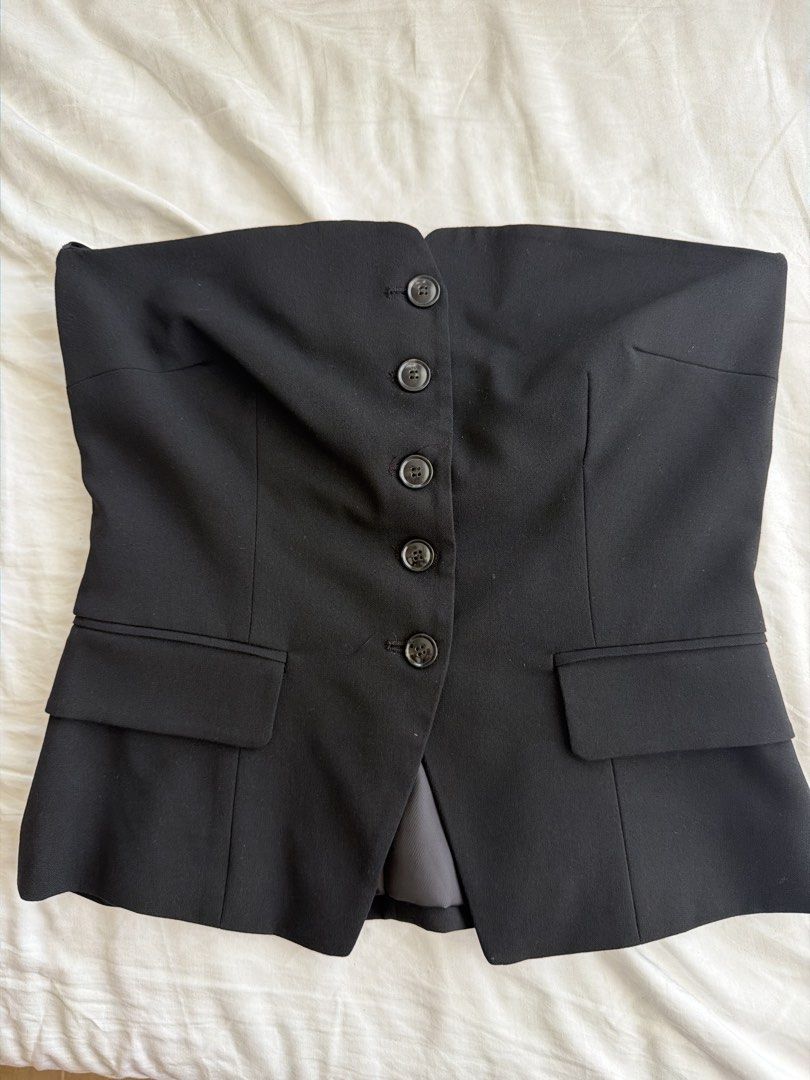 Bershka Black Strapless Button-Up Corset Top (Category: Sleeveless) located in Cavite. Submitted by klarev (Listing ID 1465019323, Image 1). Description: - Style: Strapless tube top with a chic blazer-front design - Fit & Support: No boning so it’s not a tight corset and top gripper tape to prevent slipping.