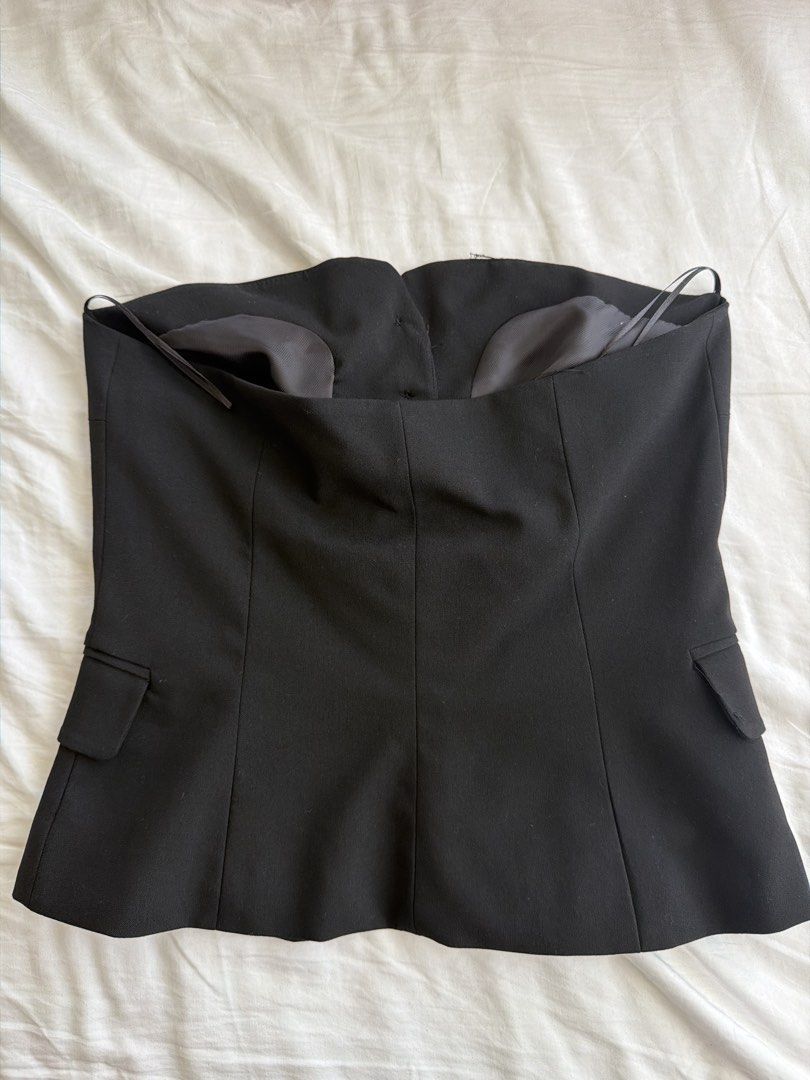 Bershka Black Strapless Button-Up Corset Top (Category: Sleeveless) located in Cavite. Submitted by klarev (Listing ID 1465019323, Image 2). Description: - Style: Strapless tube top with a chic blazer-front design - Fit & Support: No boning so it’s not a tight corset and top gripper tape to prevent slipping.