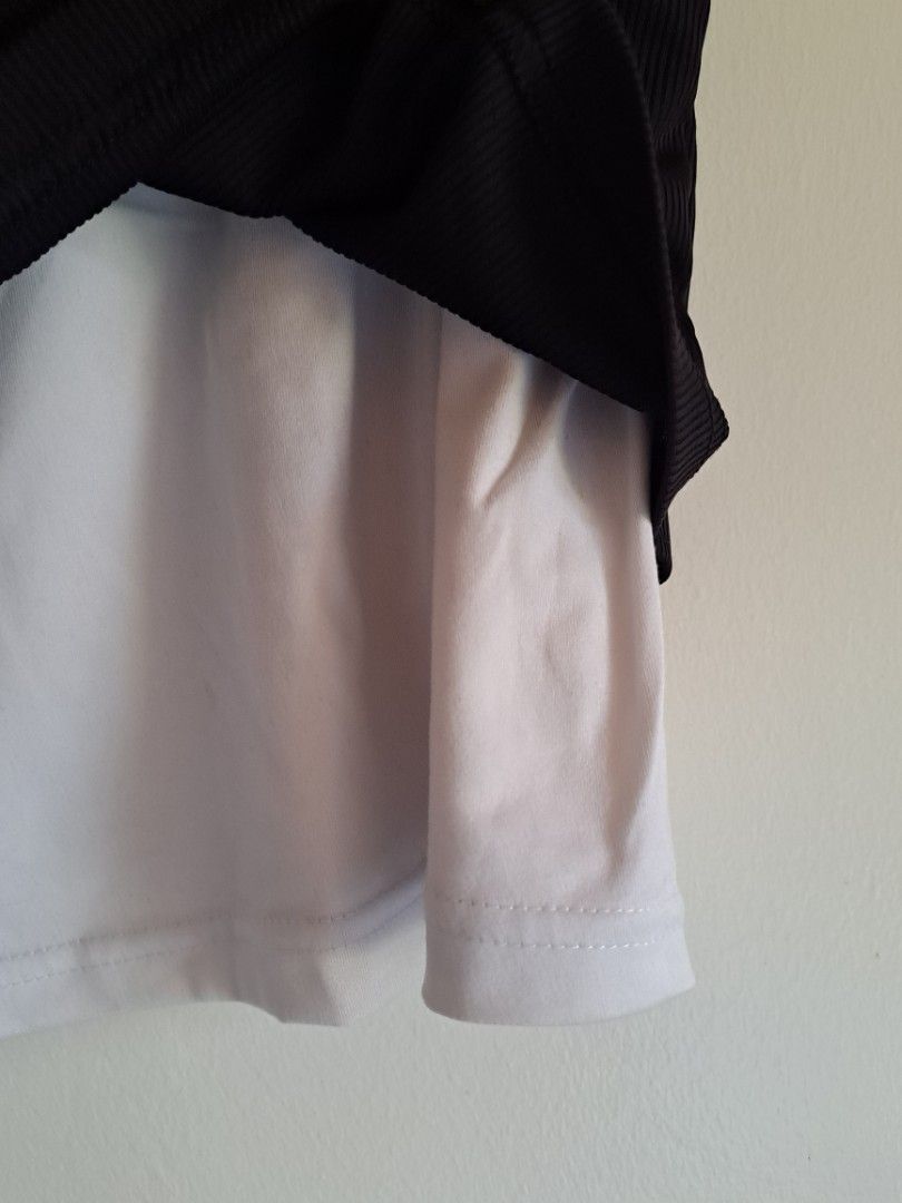 Black and White Two Piece Racerback Tank Top (Category: Sleeveless) located in Manila. Submitted by yselles__ (Listing ID 1464981919, Image 2). Description: - Material: Stretchy, comfortable fabric ideal for workouts or casual days - Condition: Excellent, no flaws, never used.