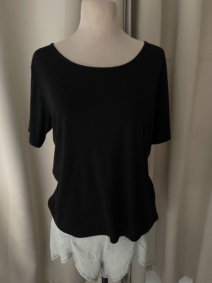 Black basic top (Category: Shirts) located in Cainta. Submitted by zlove111 (Listing ID 1465170079, Image 1). Description: - Color: Solid black - Fit: Relaxed fit through the body - Neckline: Wide scoop neck - Sleeves: Short sleeves - Material: Soft cotton-blend fabric - Styling: Versatile basic piece, perfect to pair with jeans, shorts, or skirts med-large .