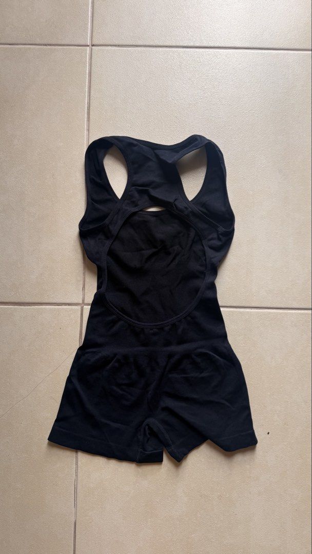 Black bodysuit one piece (Category: Rompers) located in Makati City. Submitted by chie_3030 (Listing ID 1465001478, Image 1). Description: - Color: Black - Style: Sleeveless romper with scoop neck and back - Fit: Fitted cut, Size S (tag attached) - Material: 85% polyamide, 15% elastane (super stretchy) - Ideal for: Casual day outs or workouts or outdoor activities - Condition: like new Brand: Hottie Diary from TikT0k.