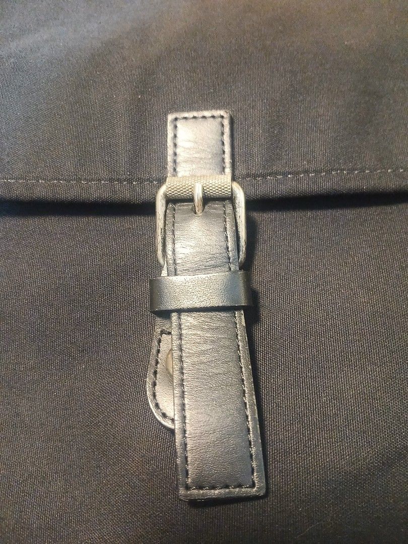 Black canvas messenger bag with buckle closure and strap (Category: Sling Bags) located in Manila. Submitted by asianwave189184 (Listing ID 1465095938, Image 2). Description: - Color: Black - Material: Durable canvas with fabric lining - Closure: Flap top with secure buckle strap - Strap: Adjustable shoulder strap for custom comfort - Storage: Roomy main compartment with a convenient back zippered pocket - Style: Simple, practical design ideal fo